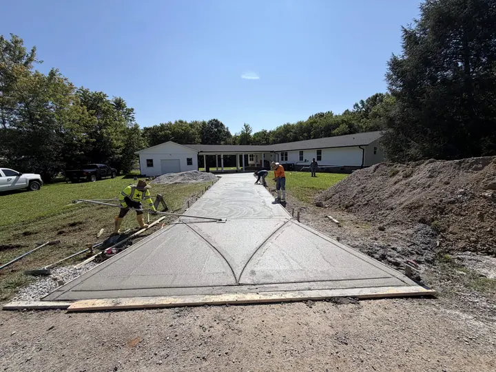 Concrete slab finishing work in progress at a job site