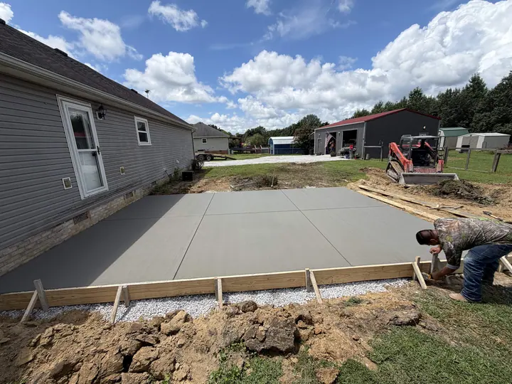 Freshly poured patio slab at a residential property