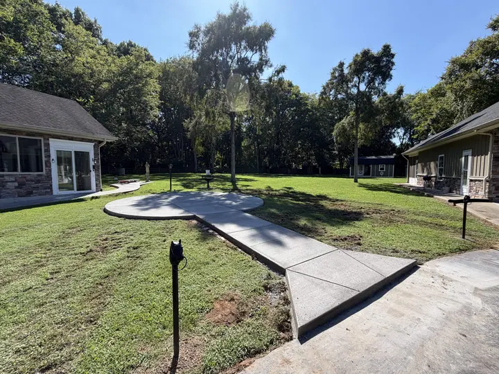 Finished curved concrete walkways connecting buildings