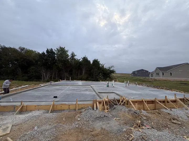 Large poured foundation slab with concrete forms still in place