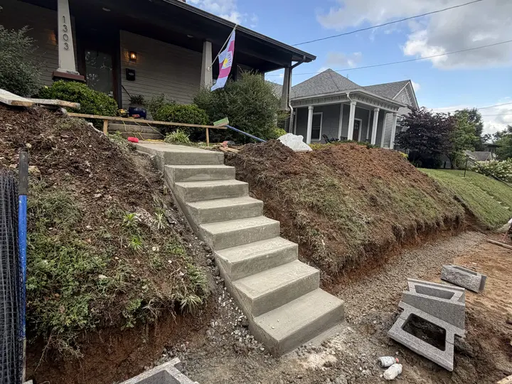 Concrete steps and landscape retaining wall on a residential slope