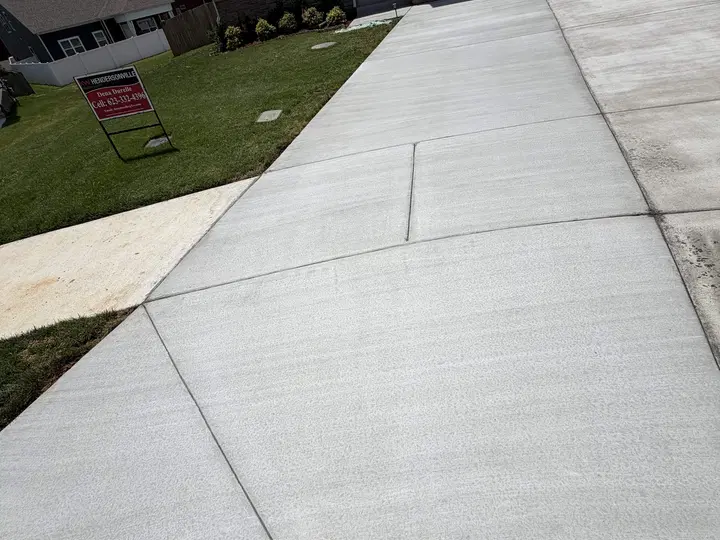 Concrete driveway leading up to a garage